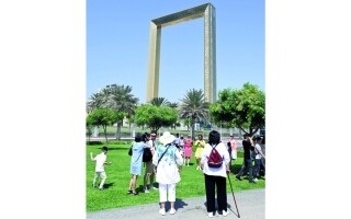 Tourists Gather at Dubai Frame for Memorable Photo