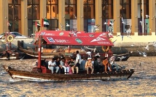 Seagulls Greet Passengers of Traditional Boat in Dubai